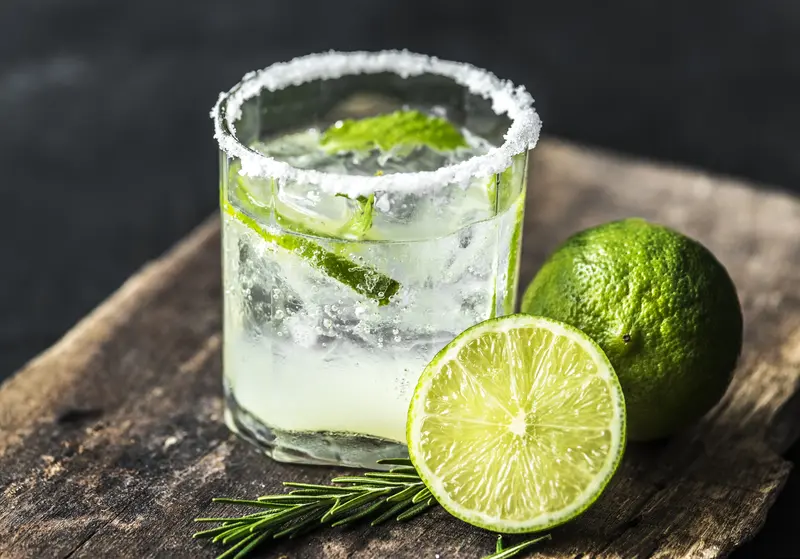 Altos tequila mojito with lime, mint and sugar rim served over ice in a short glass